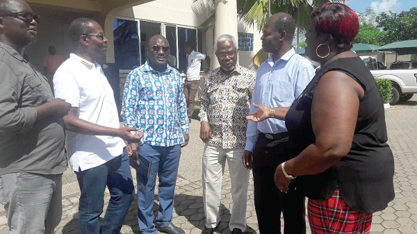 Dr Steve Manteaw (2nd right), Mr Roland Affail Monney (2nd left), President of GJA; Mr Kingsley K. Inkoom (3rd right), Mr Adjemin Boateng (3rd left), member of PIAC; Ms Mary Mensah (right), Public Relations Officer of the GJA, and Mr Moses Dotse Aklorbortu (left), Western Regional Chairman of the GJA, interacting after the first day of the seminar.