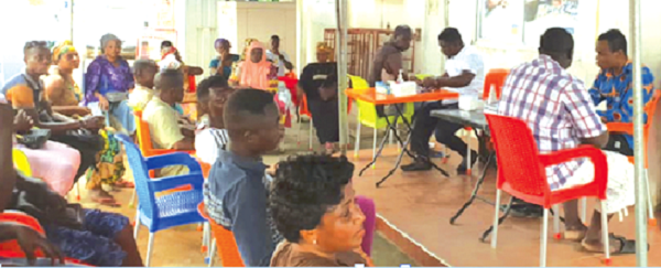 Customers going through screening at one of the branches 