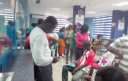 Some customers at the Pampaso branch of the Allied Savings and Loans trying to access their deposits 