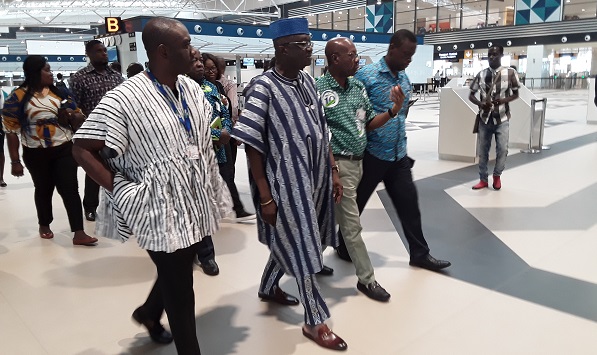 Mr Attafuah (in green) guiding the Minister (in smock) on the tour of Terminal 3.