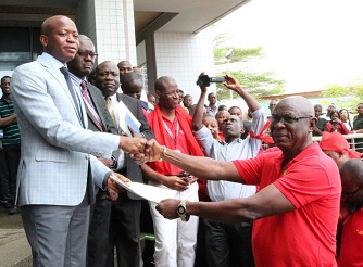 Mr Michael Luguje, acting Director General of GPHA, receiving the petition from Mr Daniel Owusu-Koranteng, General Secretary of MDU. Picture: DELLA RUSSEL OCLOO