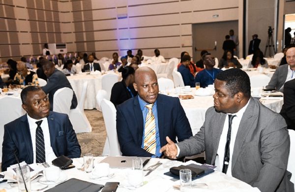 Professor Peter Quartey (right) interacting with Mr Ato Afful, Managing Director of the Graphic Communications Group Limited (middle) and Mr Alhassan Andani (left), Managing Director, Stanbic Bank Ghana at the Graphic Business/Stanbic Breakfast meeting