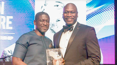 Mr Kevin Okyere (left), springfield CEO, receiving the award from Mr Gregg Bishop of Face2Face Africa