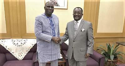  Dr Owusu Afriyie Akoto in a handshake with Mr Salifou Ouedraogo after their meeting