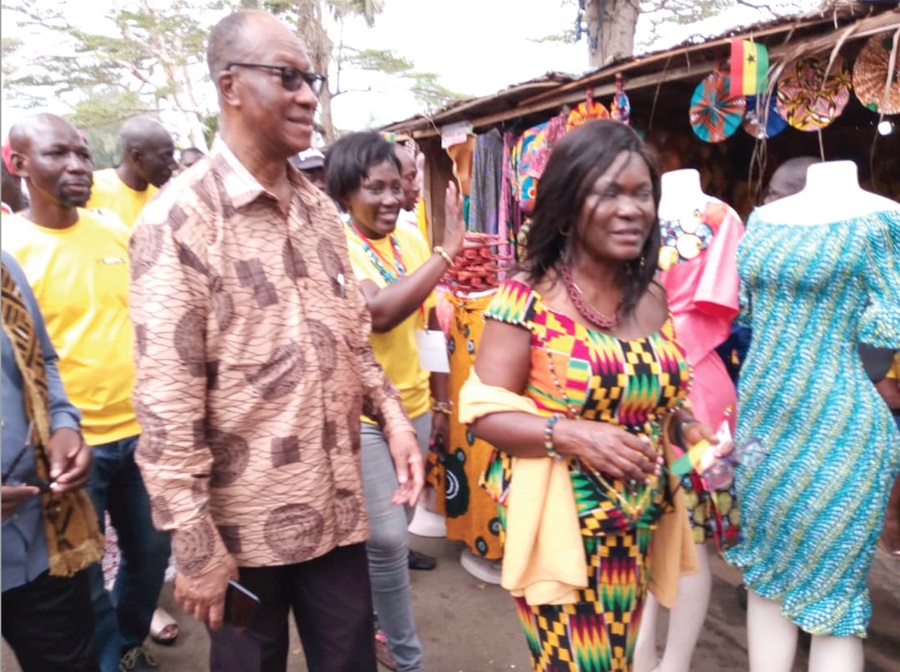 Mr Frederick Daniel Laryea (left), Ghana’s Ambassador to Cote d’Ivoire and Mrs Agnes Adjei-Sam (right) touring the handicraft exhibition