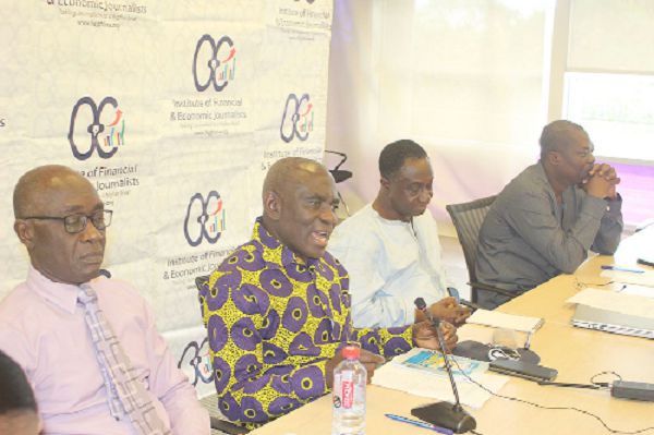 Mr Abraham Dwuma Odoom (2nd left), MP for Twifo Atti Morkwa Constituency, launching the sixth Financial and Economic Journalism awards in Accra. With him are Mr Raybon Bulley (left), Mr Kwadwo Tutu (2nd right) and Professor John Gatsi (far right), Head, Dept of Finance, University of Cape Coast Business School. Picture: GABRIEL AHIABOR