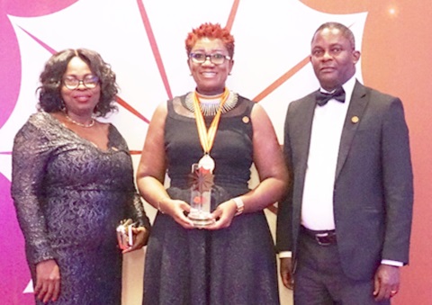 Nana Efua Rockson (middle), Group Head, Corporate Affairs & Marketing, with Ms Ekua Asemani-Oku (left), acting National Sales Manager, and  Mr Charles Graham-Mensah, Head of Marketing, after receiving the award