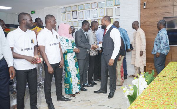  Mr Daniel McKorley (right), congratulating the 10 finalists of the McDan Entrepreneurship Challenge programme after the unveiling ceremony. Picture: EBOW HANSON