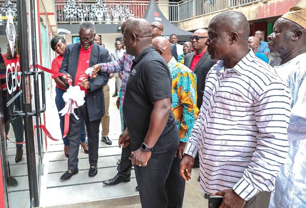 Mr Daniel Wilson Addo (2nd right) and other officials of the bank after they jointly cut the ribbon to officially inaugurate the new branch