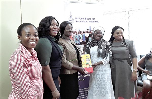 Ms Kosi Yankey (3rd left) presenting a prize package to Ms Khadijah Erasung (2nd right). With them are Mrs Roseline Delali Ashigbui (2nd right) and Ms Padiki Bukari (1st left)