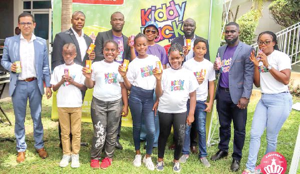 Some officials of Kasapreko and Tetran Pak with some children after the launch