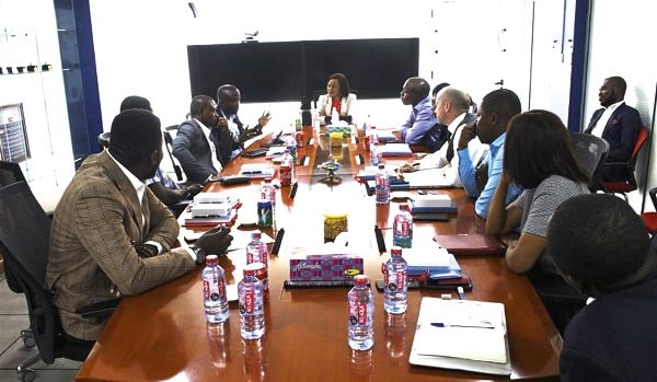 Ms Mitwa Kaemba Ng’ambi (head of table) and Mr Charles Benoni Okine (arrowed) in the meeting with the managers of the company and the executives of the NCR