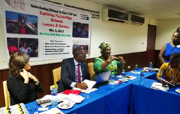 Mrs Mercy Afrowa Needjan (right) explaining a point. With her is Mrs Marlese von Broembsen (left) and another representative at the event.