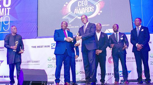 Dr Mahamudu Bawumia (2nd left) presenting one of the awards to Mr Edward Effah