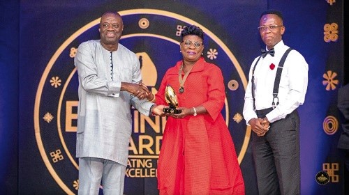 Dr Ibrahim Mohammed Awal (left), Business Development Minister, presenting the award to Ms Benonita Bismarck (middle).