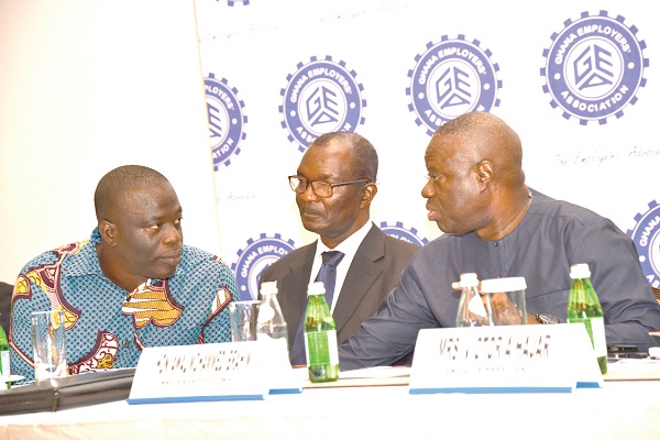   Dr Ibrahim Mohammed Awal (right) having discussions with  Mr Ignatius Baffour Awuah (left), and Mr Dan Akyeampong during the AGM of the GEA.