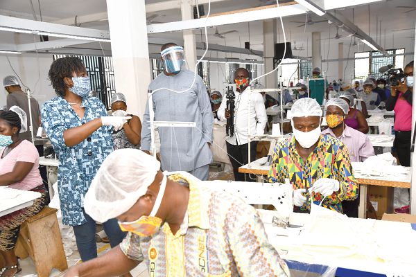  Mrs Adjo Dede Asare (left) conducting Mr Lawrence Agyinsam (right) round the factory. Pictures: EBOW HANSON