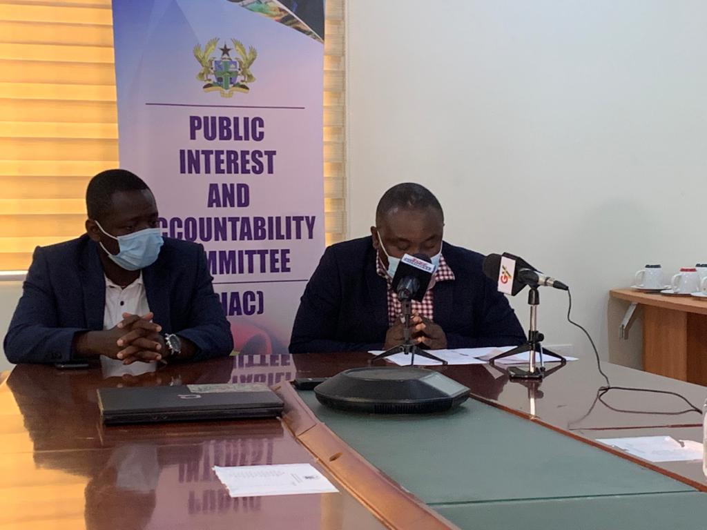 Mr Noble Wadzah (right), the Chairman of PIAC, speaking at the launch of the Issue Paper. Looking on is Mr Mark Agyeman, the Technical Manager, PIAC.