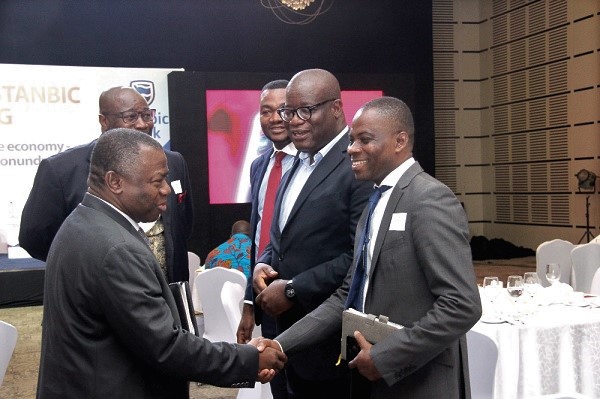  Mr Alhassan Andani (left) in a handshake with Mr Stephen Addai-Baah (right), Public Relations Officer of the National Blood Service. With them are Mr Theophilus Yartey (2nd right) Editor, Graphic Business, Mr Kojo Larbi (arrowed), Communications Manager, Stanbic Bank Ghana. Picture: Benjamin Obuobi 