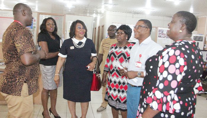  Mr Samuel Doe Ablordeppey (left), News Editor, Daily Graphic, explaining a point to Mrs Jemima Oware (3rd left), the Registrar-General, and her team during the visit to the newsroom of the Graphic Communications Group Limited in Accra. Looking on are Mr Kobby Asmah (2nd right) and some members of the Editorial team. Picture: EDNA SALVO-KOTEY