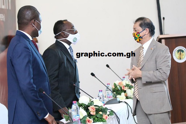 Dr Owusu Afriyie Akoto (2nd left) interacting with Mr Tsutomu Himeno (right), Japanese Ambassador to Ghana. Looking on is Mr Joseph Boahen Aidoo, CEO, COCOBOD 