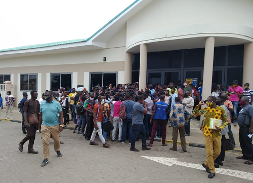 The NDC fact-finding team briefing the media about the visit outside the revenue office.