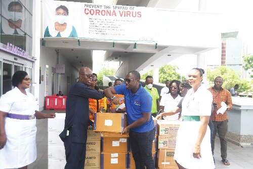 Mr Solomon Ohene Owusu (right) presenting the medical supplies to Dr Emmanuel Srofenyoh in Accra.