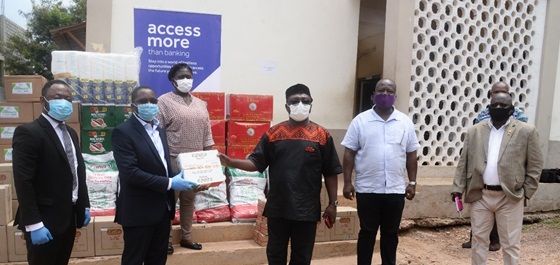 Nana Adu Keremateng, Head of Corporate Communications at Access Bank presents items to Albert Boakye Okyere, MCE for Ashaiman