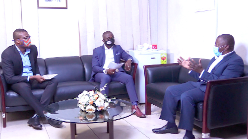  Mr Alhassan Andani (right) explaining a point to Mr Charles Benoni Okine (middle) and Mr Emmanuel Bruce during the interview