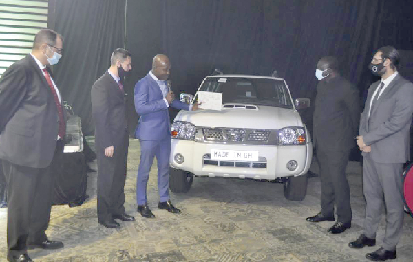 Mr Alan Kyerematen (2nd right) joins Nissan and JMTC officials to endorse the first assembled Nissan Pickup from Japan Motors