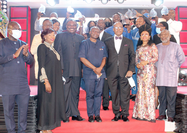 Mr Ofori-Atta (middle), Minister of Finance, Mr Ahomka-Lindsay (3rd left), Deputy Minister of Trade, and Dr Addison (3rd right), the Governor of BoG, with the award winners after the ceremony