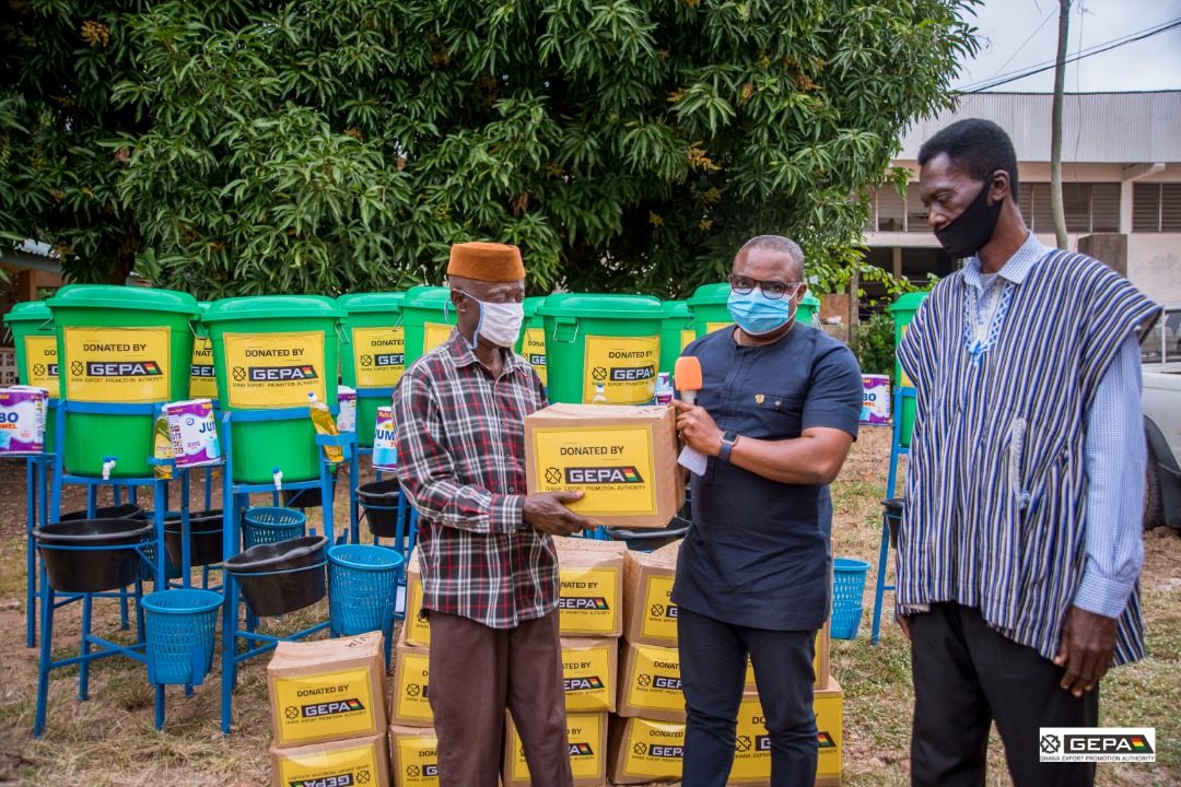 Mr Samuel Dentu (2nd right) making a presentation to Mr Robert Dzokoto (left) at Ho