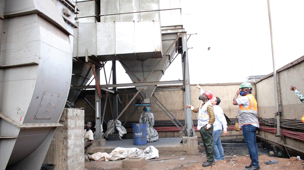 Mr Fadi Chami (not in helmet) explaining a point to Mr Herry Kokofu (hand in pocket) at the premises of United Steel. Picture: DELLA RUSSEL OCLOO