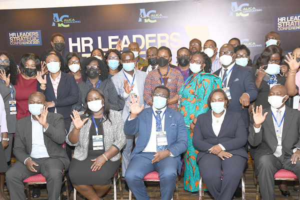  Ms Gloria Quartey (seated 2nd right), Director of Human Resources, Bank of Ghana and Mr Andy Okrah (seated middle), with participants after the opening session of a two-day Hunan Resource Leaders Strategic Conference