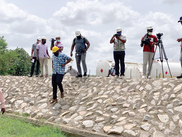  Mr Edwin Alfred Provencal (arrowed),  Managing Director of BOST, inspecting the depot