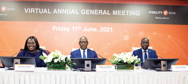 Mr Edward Effah (middle) addressing the virtual AGM. He is flanked by Mr Julian Opuni (right), Managing Director, and Ms Maataa Opare, Group Head of Legal and Company Secretary of the bank respectively.     