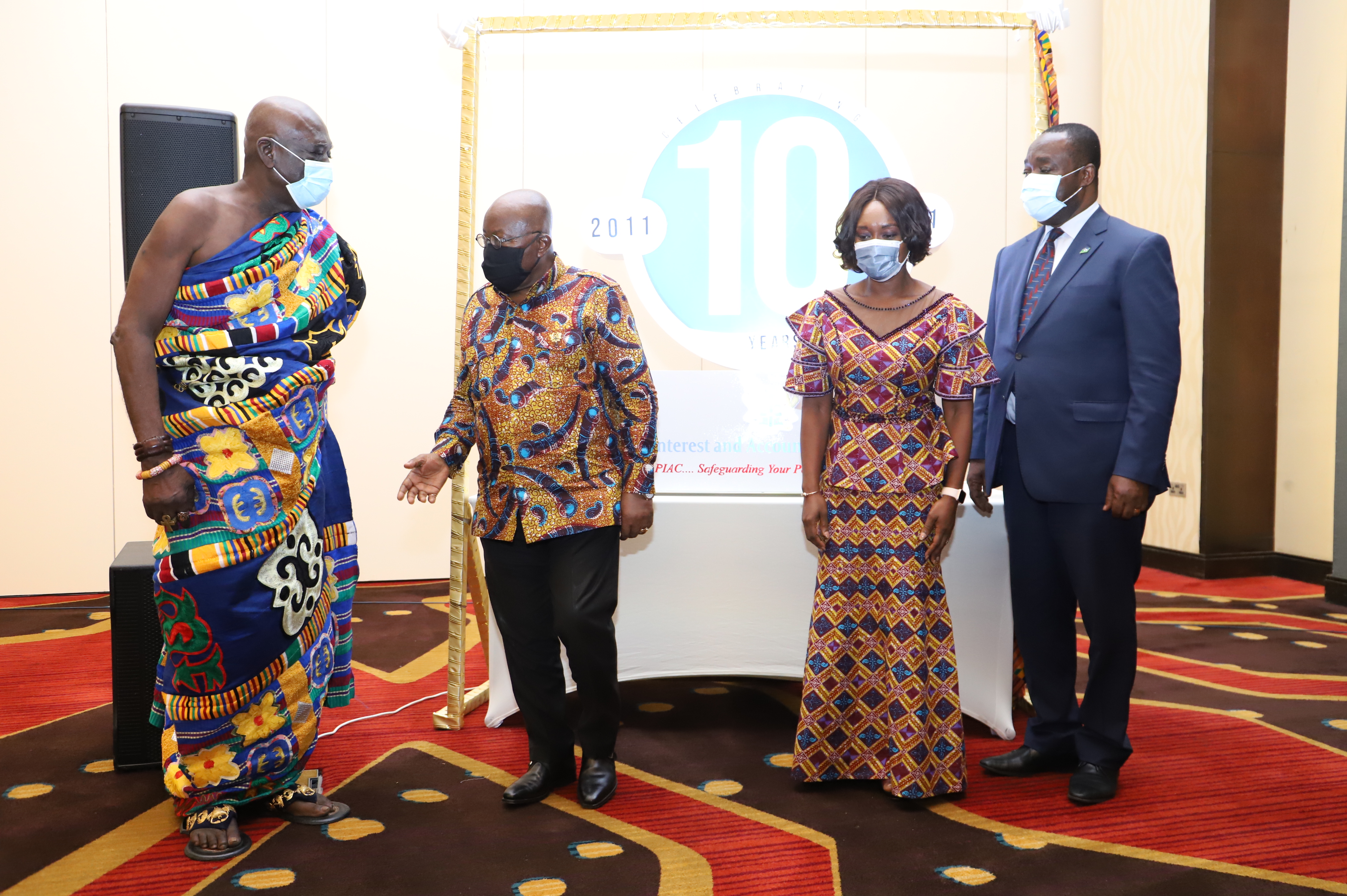 President Akufo-Addo interacting with Osabarima Akwasi Attah II (left), Omanhene of the Ogua traditional area, Prof. Kwame Adom-Frimpong (right), Chairman, PIAC, and Ms Abena Osei, former Deputy Minister of Finance after the launch of PIAC 10 the anniversary in Accra