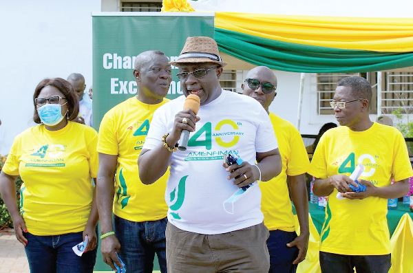  Dr Tony Aubuyn (with mic), Board Chairman of the bank, launching the anniverssary. With him are other officials of the bank