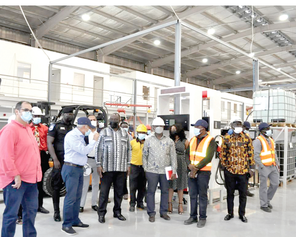 Mr Alan Kyerematen (3rd from left), Trade and Industry Minister, being briefed by Mr Mohammed Byrouthy (2nd from left), during the facility visit