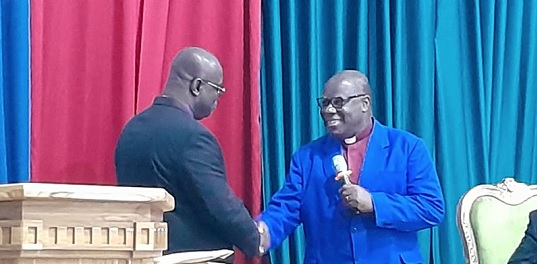 Rt Rev. Professor Joseph Obiri Yeboah Mante (right), Outgoing Moderator of the General Assembly of the Presbyterian Church of Ghana, congratulating the newly elected Moderator, Rev. Dr Abraham Nana Kwakye.