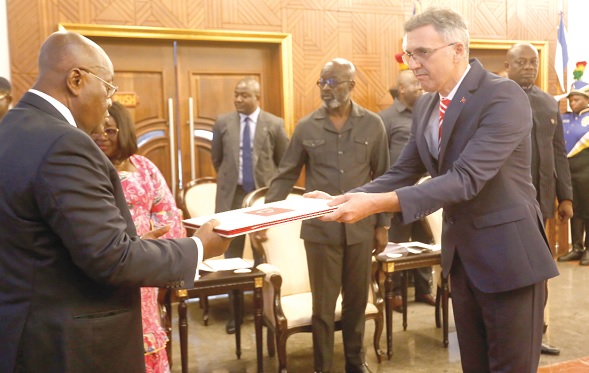 Huseyin Gungor (right), Turkiye Ambassador to Ghana, handing over letters of credence to President Akufo-Addo