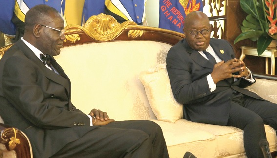 President Akufo-Addo (right) interacting with Assielou Felix Tanon, Cote d’lvoire Ambassador to Ghana