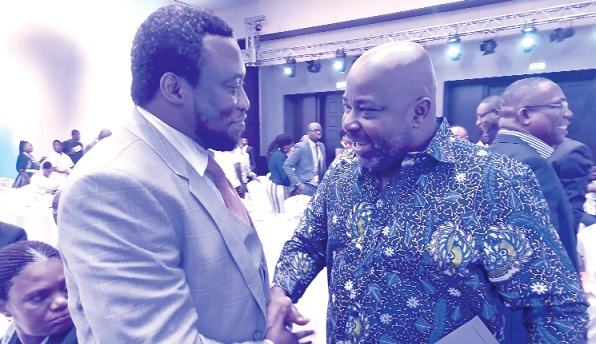 • Michael Okyere Baafi (right), Deputy Minister of Trade and Industry, in a chat with Dr Sam Ankrah, President of the Africa Investment Group and Chairman of the Planning Committee of the summit