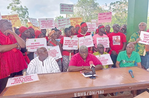 Dr Nii Addo Bruce (middle), a past President of the Ebenezer SHS old students association, with other members of the group addressing the media 