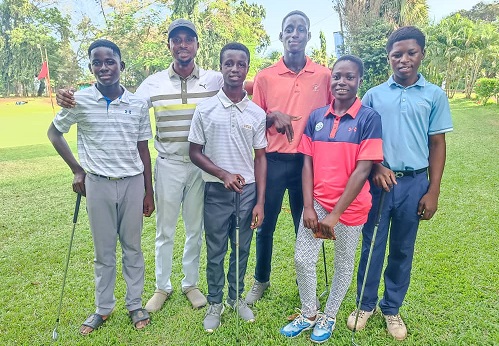 The members of the national junior golf team with their coach.