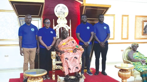  Okyenhene Osagyefuo Amoatia Ofori Panin (seated) together with team members of See Something, Say Something at Kyebi