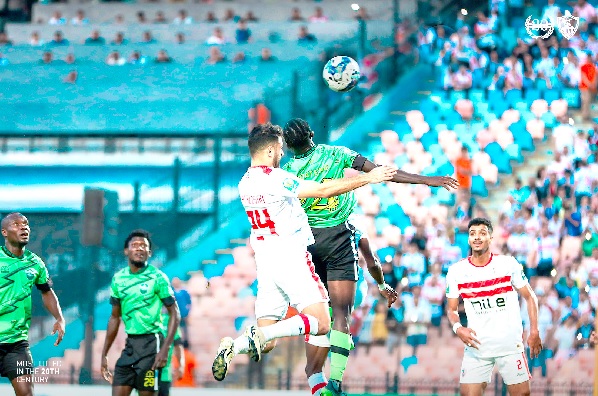 Dreams FC’s Agyenim Boateng and a Zamalek player in an aerial challenge for the ball during the match