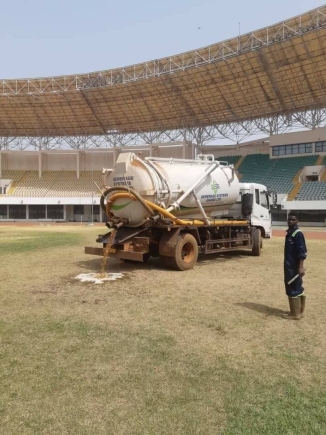 Maintaining the grass at the Aliu Mahama Stadium in Tamale