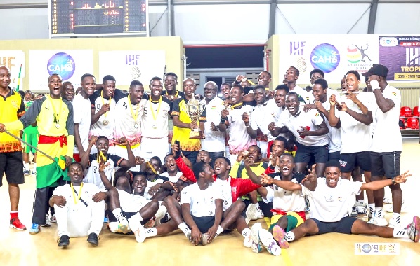Players and officials of Ghana’s handball teams celebrating their sucess
