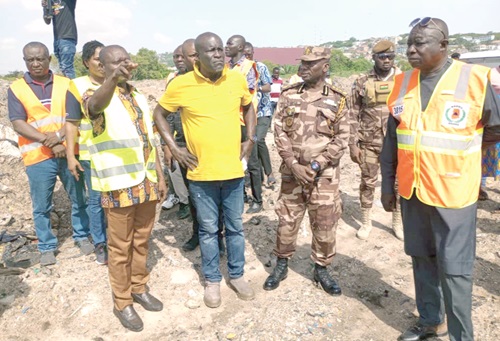 Daniel Titus-Glover (hands akimbo), Greater Accra Regional Minister designate, and some members of the REGSEC during the tour of the Sakumo Ramsar site